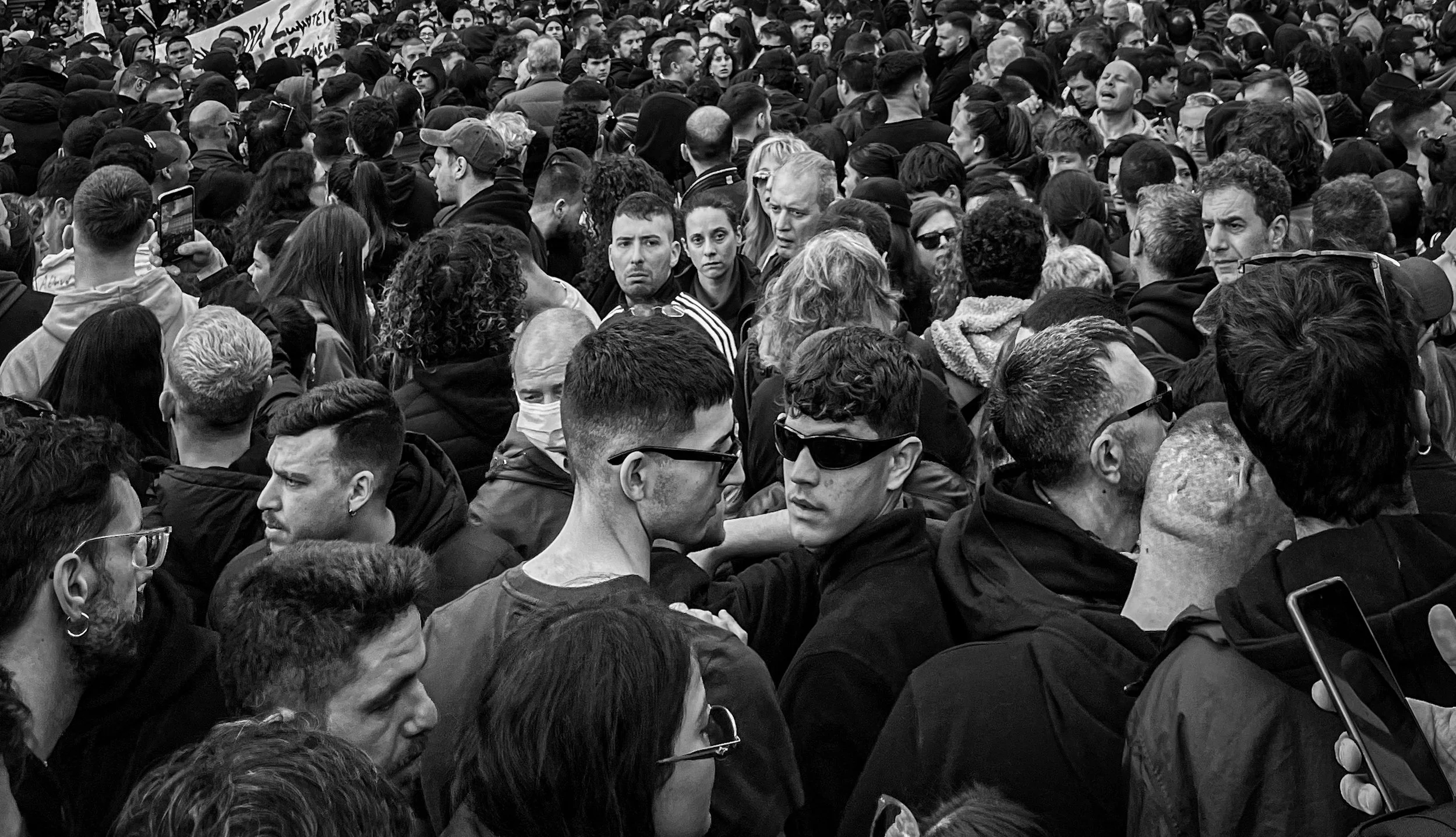 A crowded gathering in black and white.